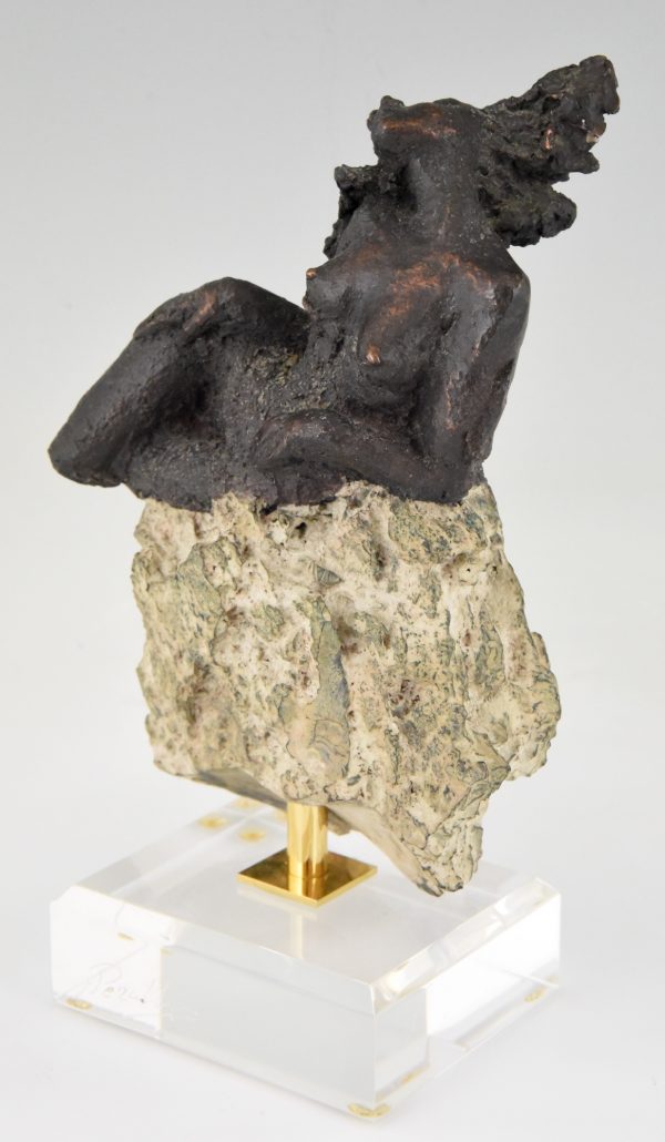 Sculpture nude on a rock