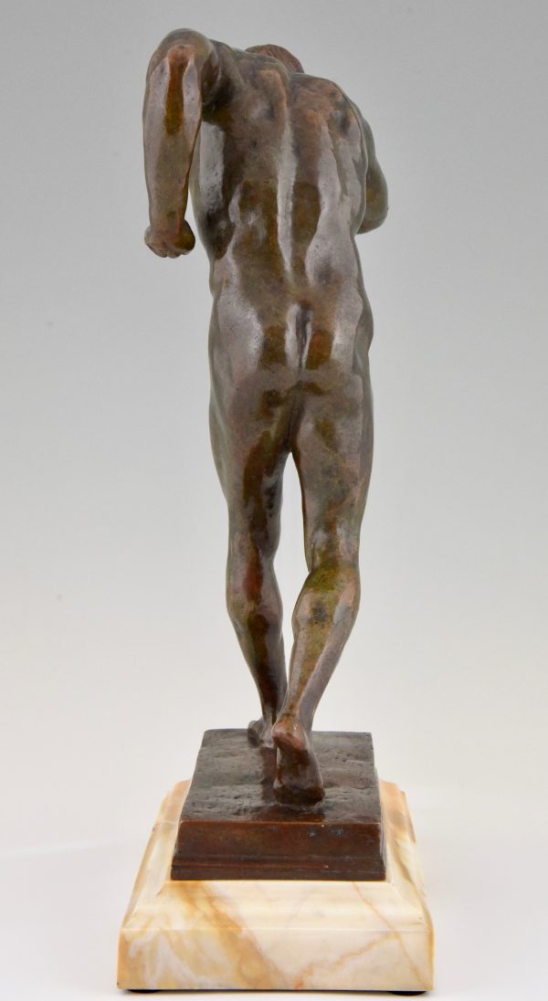 Antique bronze sculpture of a male nude athlete