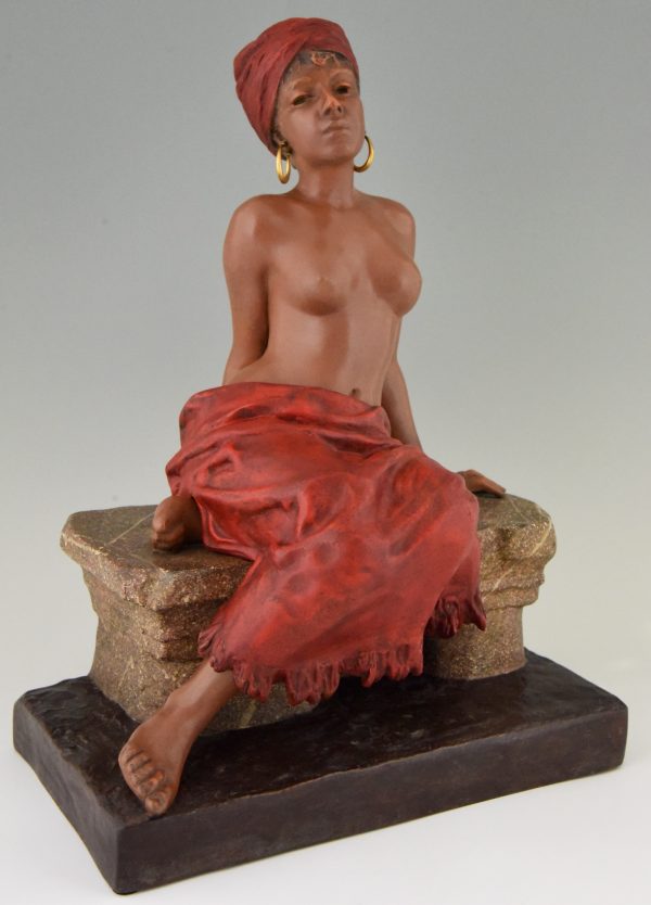 Art Nouveau sculpture of a seated nude with removable skirt.