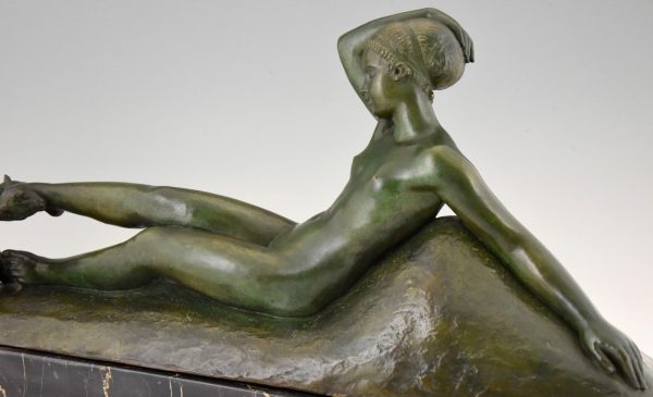 Art Deco bronze sculpture of a reclining nude with goats