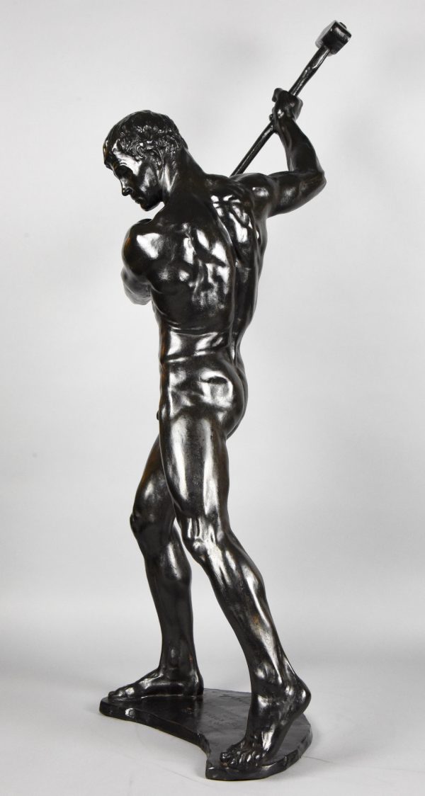 Half size sculpture male nude with sledgehammer 
