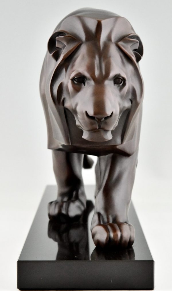 Art Deco style sculpture of a walking lion.